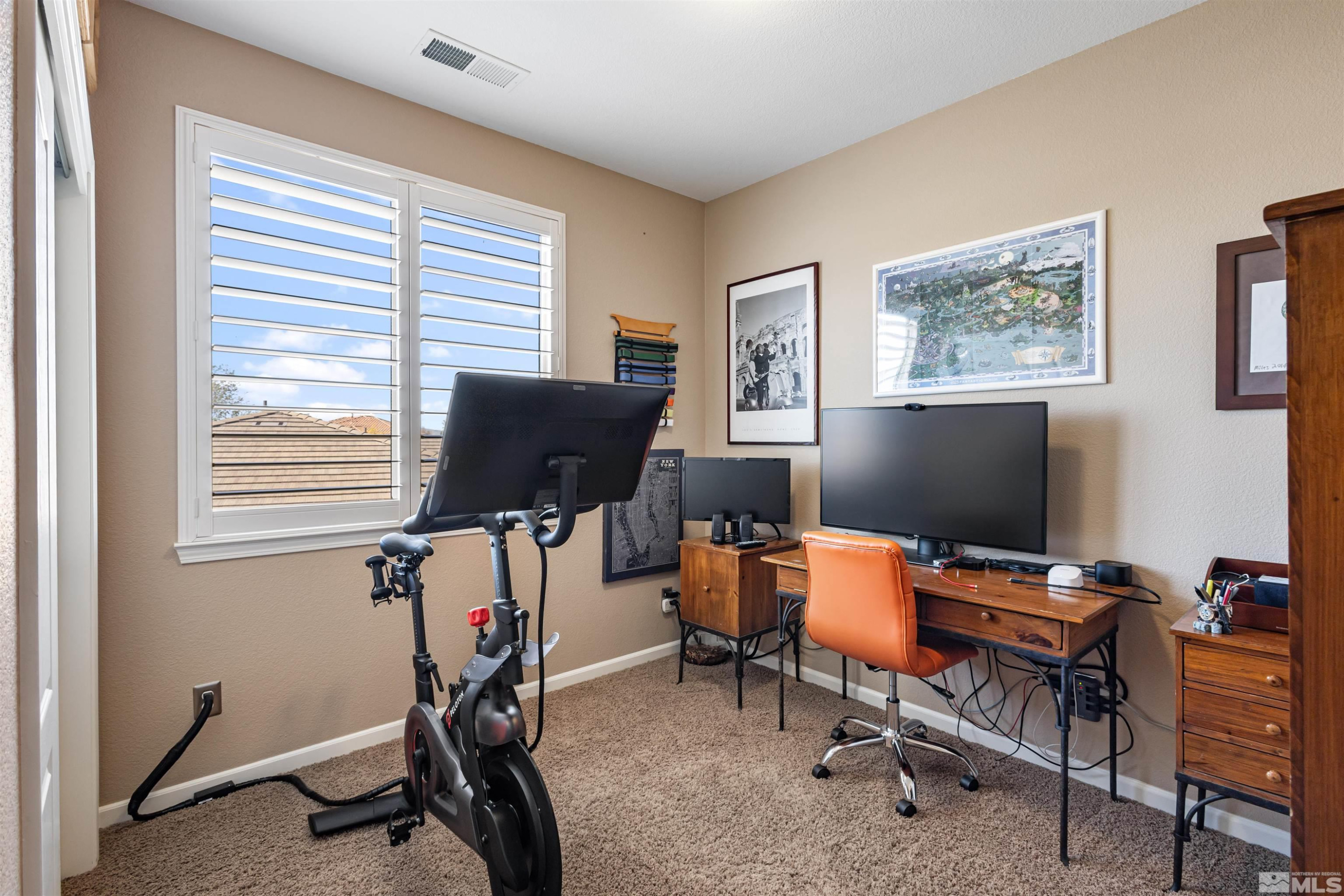 14025 Tagor Road Reno, NV 89521 - Photo 24 of 39 a view of a workspace with furniture and a window