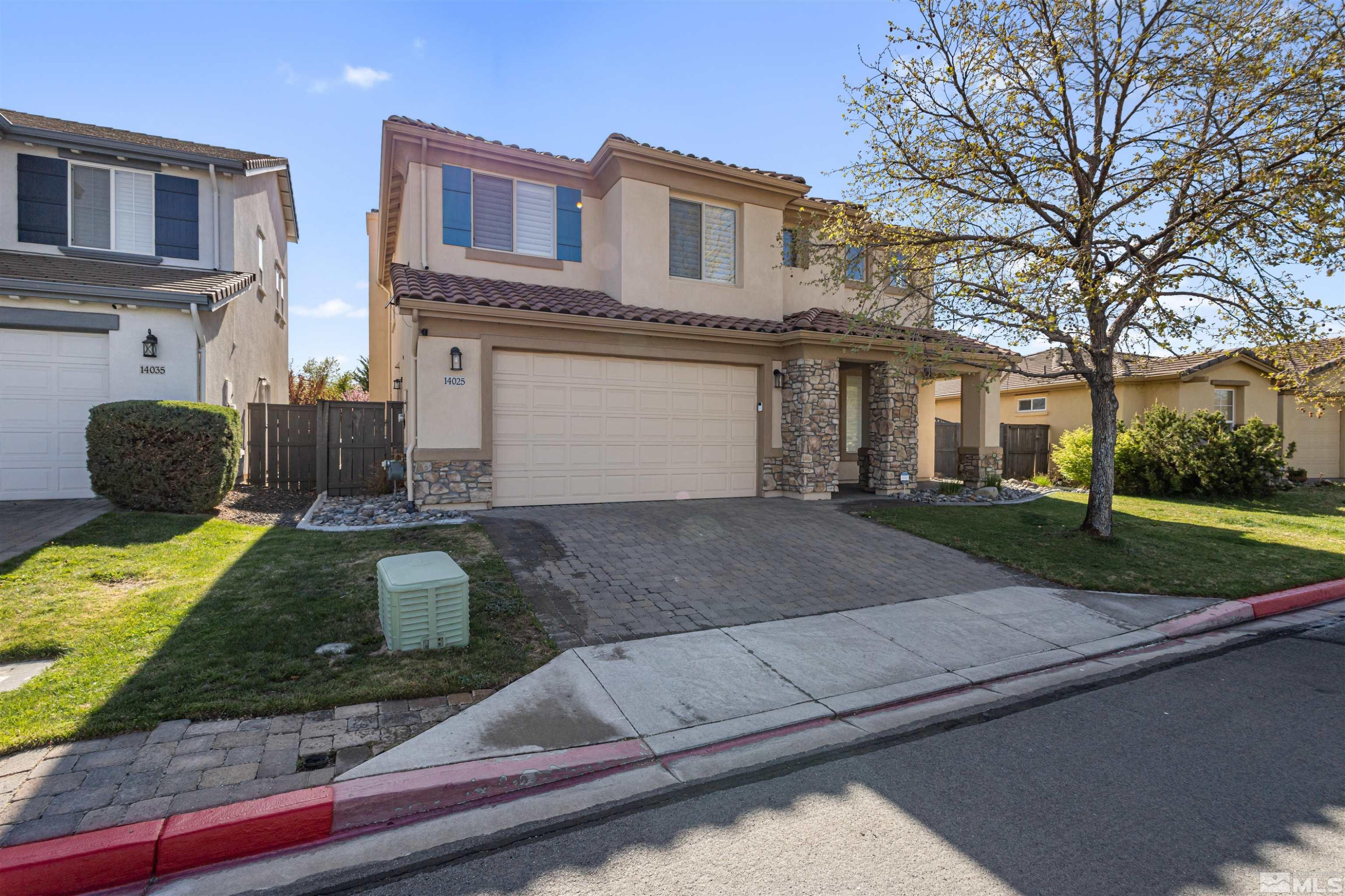 14025 Tagor Road Reno, NV 89521 - Photo 3 of 39 a front view of a house with a yard