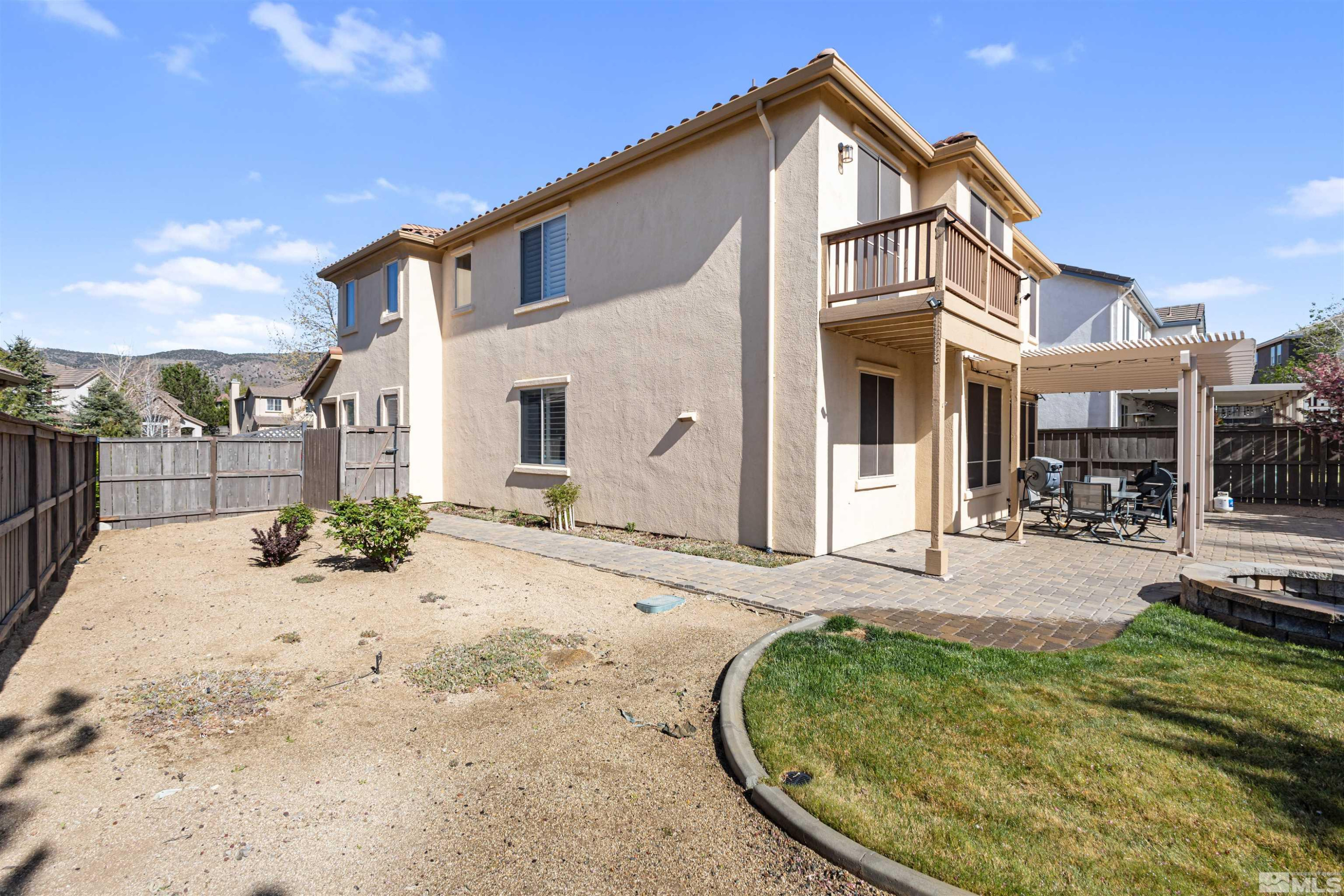 14025 Tagor Road Reno, NV 89521 - Photo 33 of 39 a view of a house with wooden fence