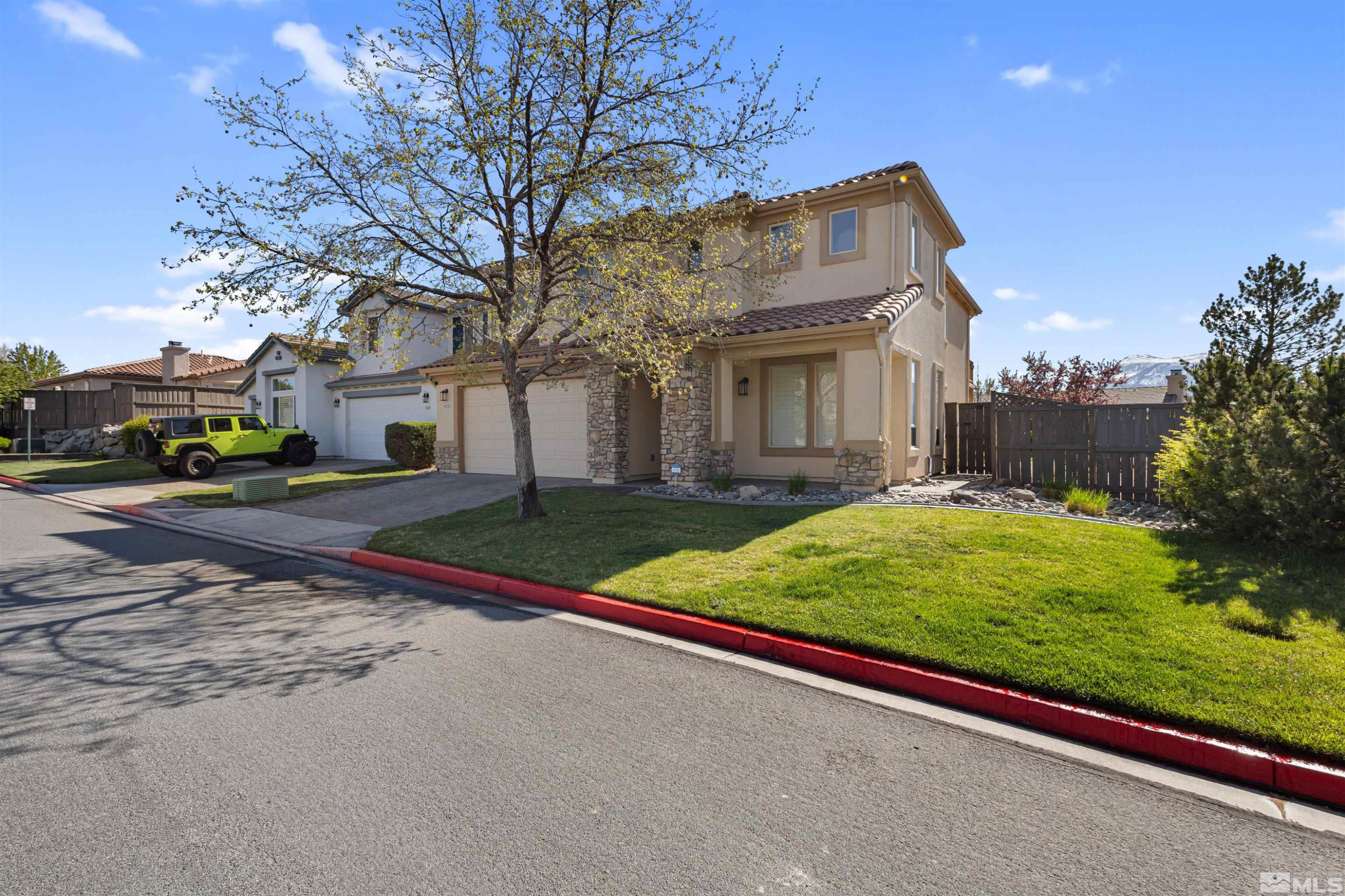 14025 Tagor Road Reno, NV 89521 - Photo 39 of 39 a view of an house with backyard and road