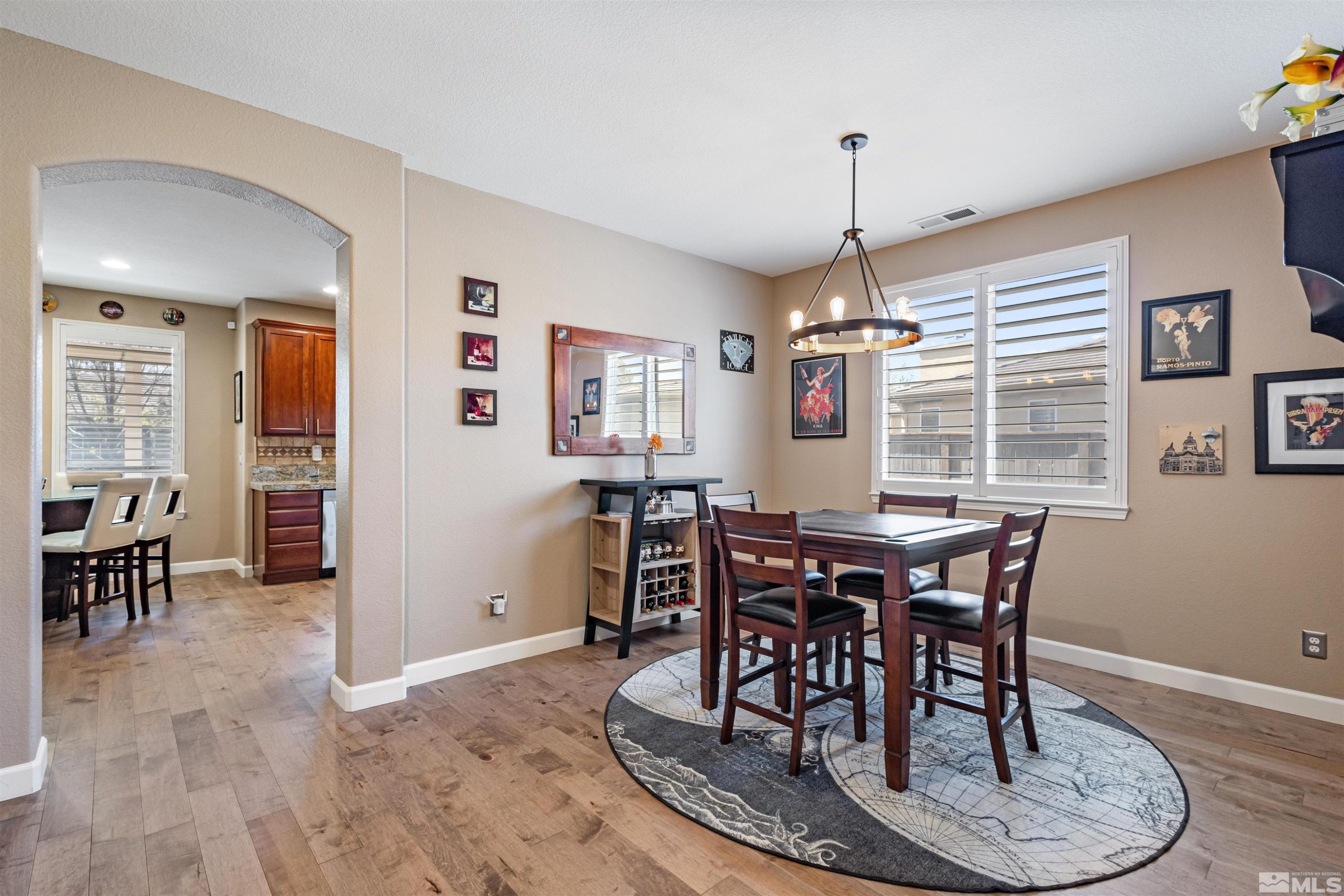14025 Tagor Road Reno, NV 89521 - Photo 8 of 39 a dining room with furniture window and wooden floor