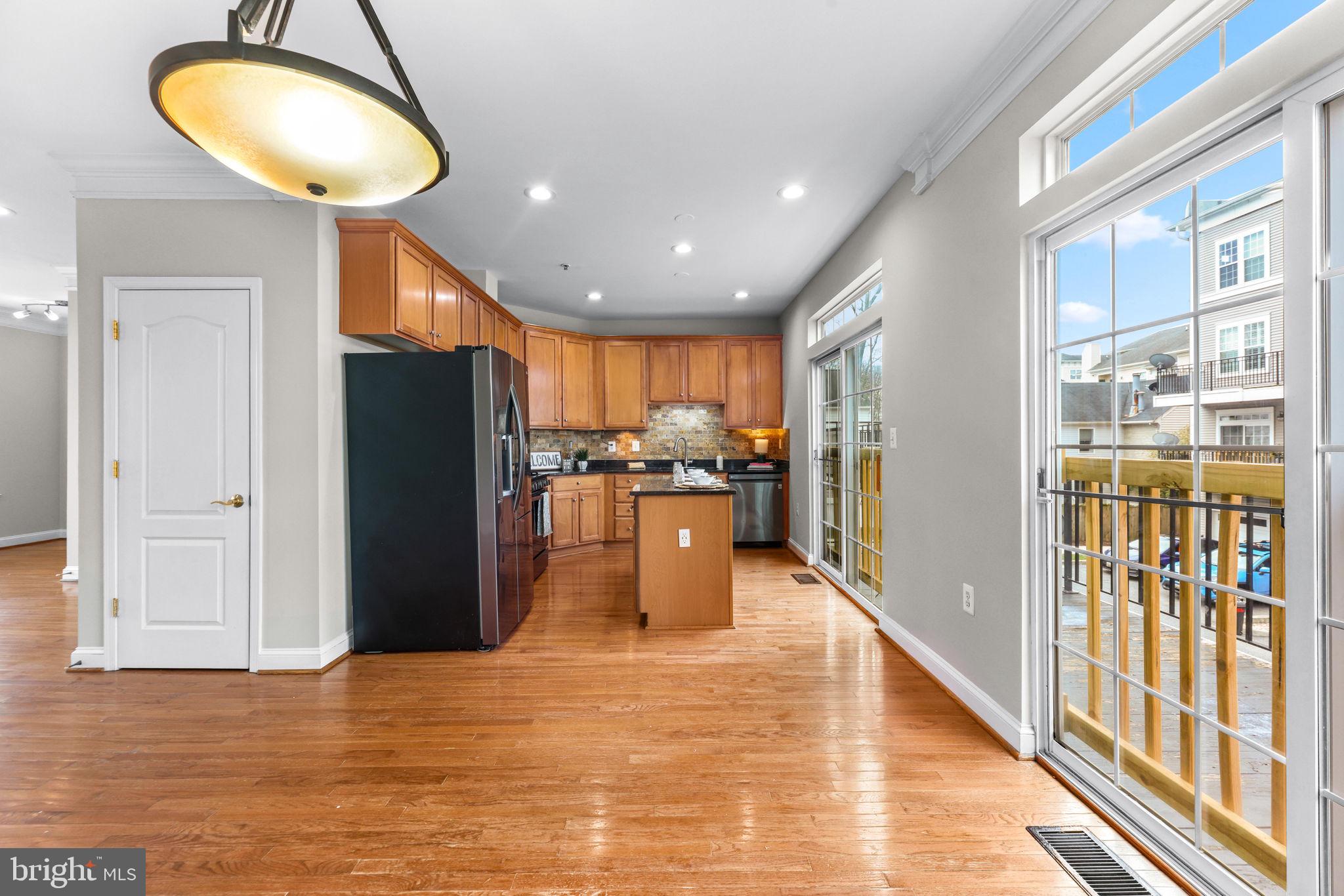 224 North Summit Avenue Gaithersburg, MD 20877 - Photo 12 of 34 a kitchen with stainless steel appliances granite countertop a refrigerator a oven and a large window