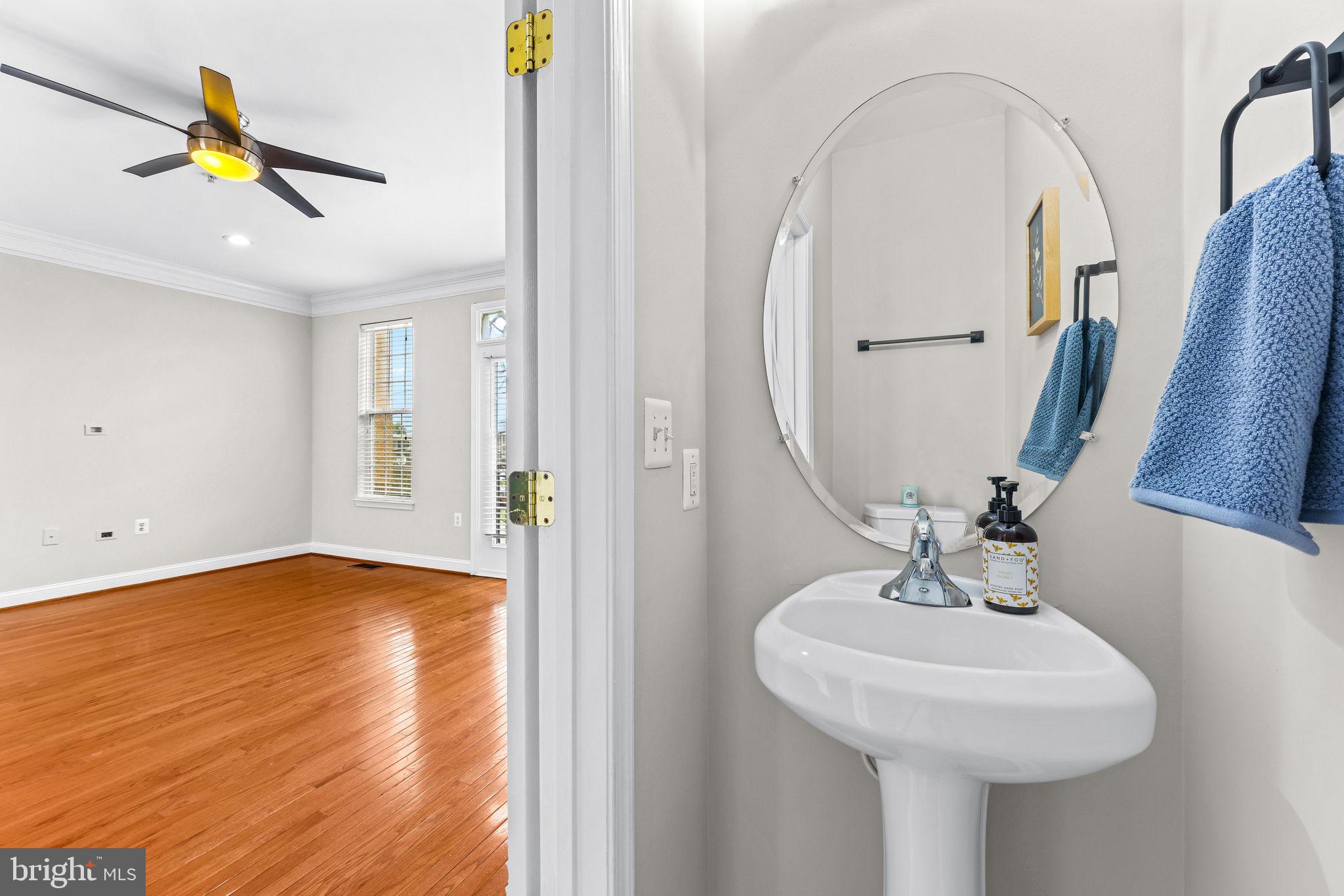 224 North Summit Avenue Gaithersburg, MD 20877 - Photo 17 of 34 a bathroom with a sink and a mirror