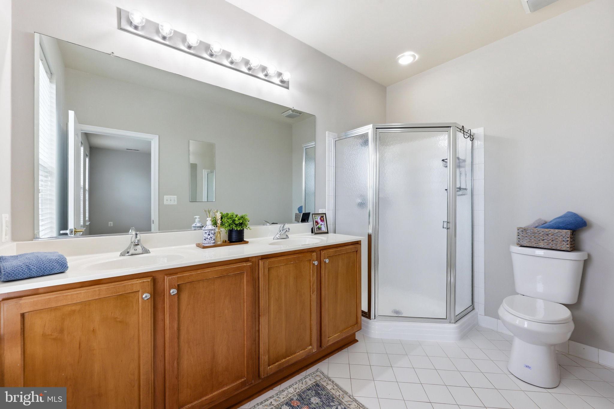 224 North Summit Avenue Gaithersburg, MD 20877 - Photo 23 of 34 a spacious bathroom with a double vanity sink mirror and toilet