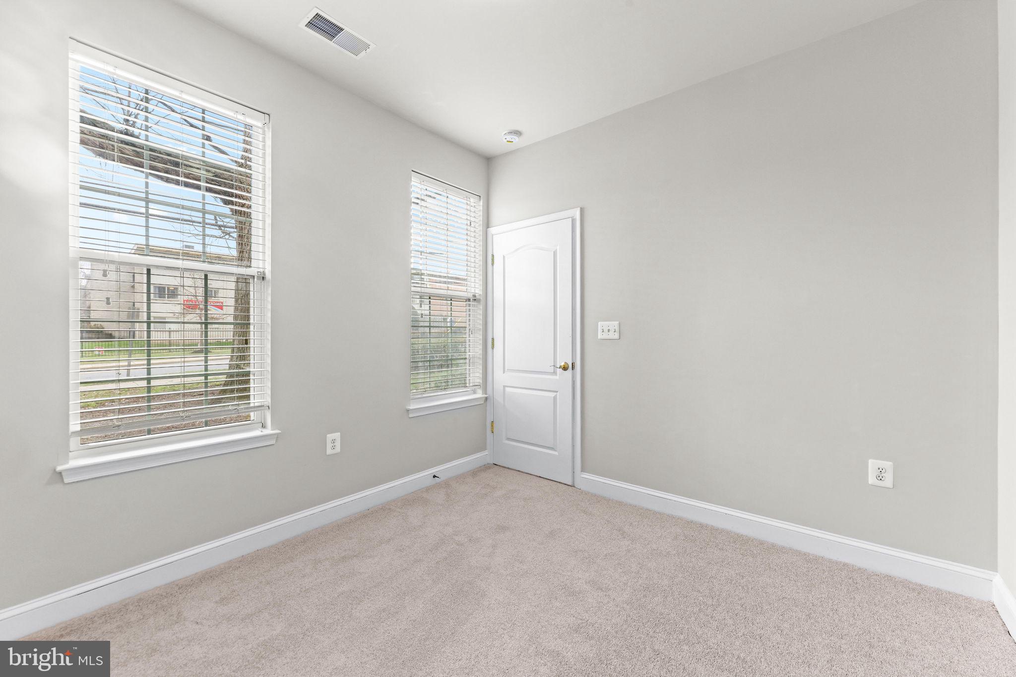 224 North Summit Avenue Gaithersburg, MD 20877 - Photo 4 of 34 a view of an empty room with a window