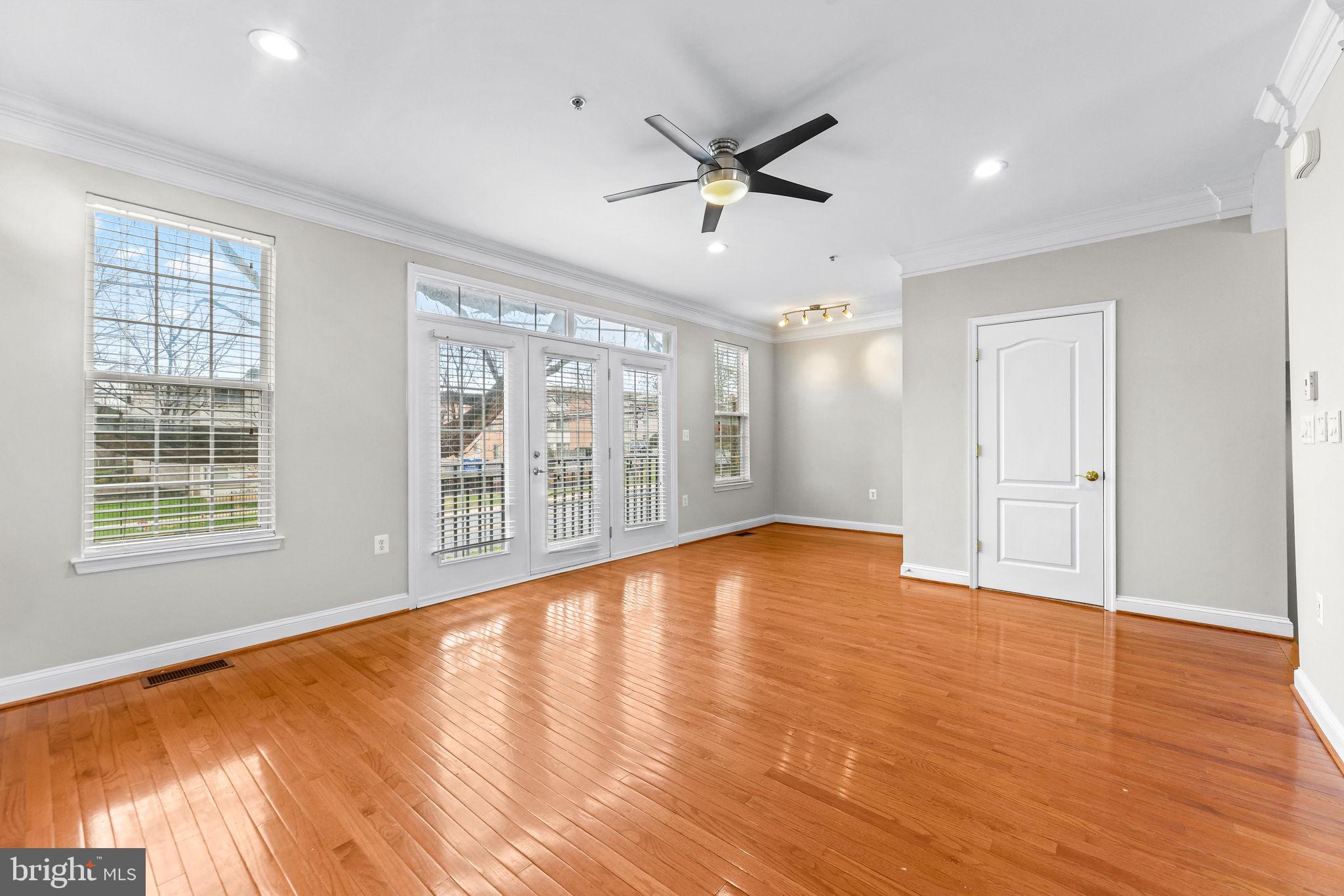 224 North Summit Avenue Gaithersburg, MD 20877 - Photo 6 of 34 a view of an empty room with wooden floor and a window