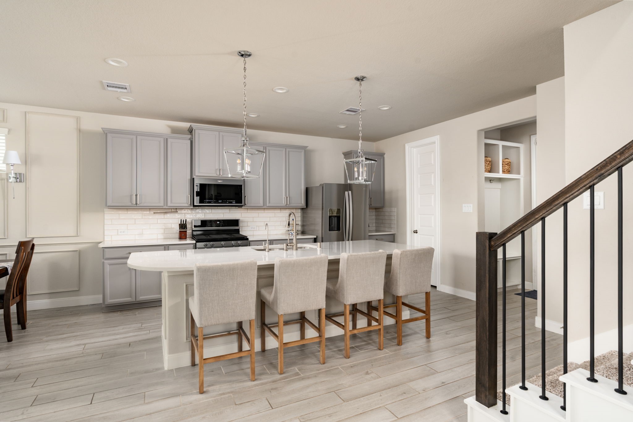 9810 Falling Fern Lane Houston, TX 77080 - Photo 17 of 30 This kitchen features a beautiful large island, breakfast bar seating, and stainless steel appliances.