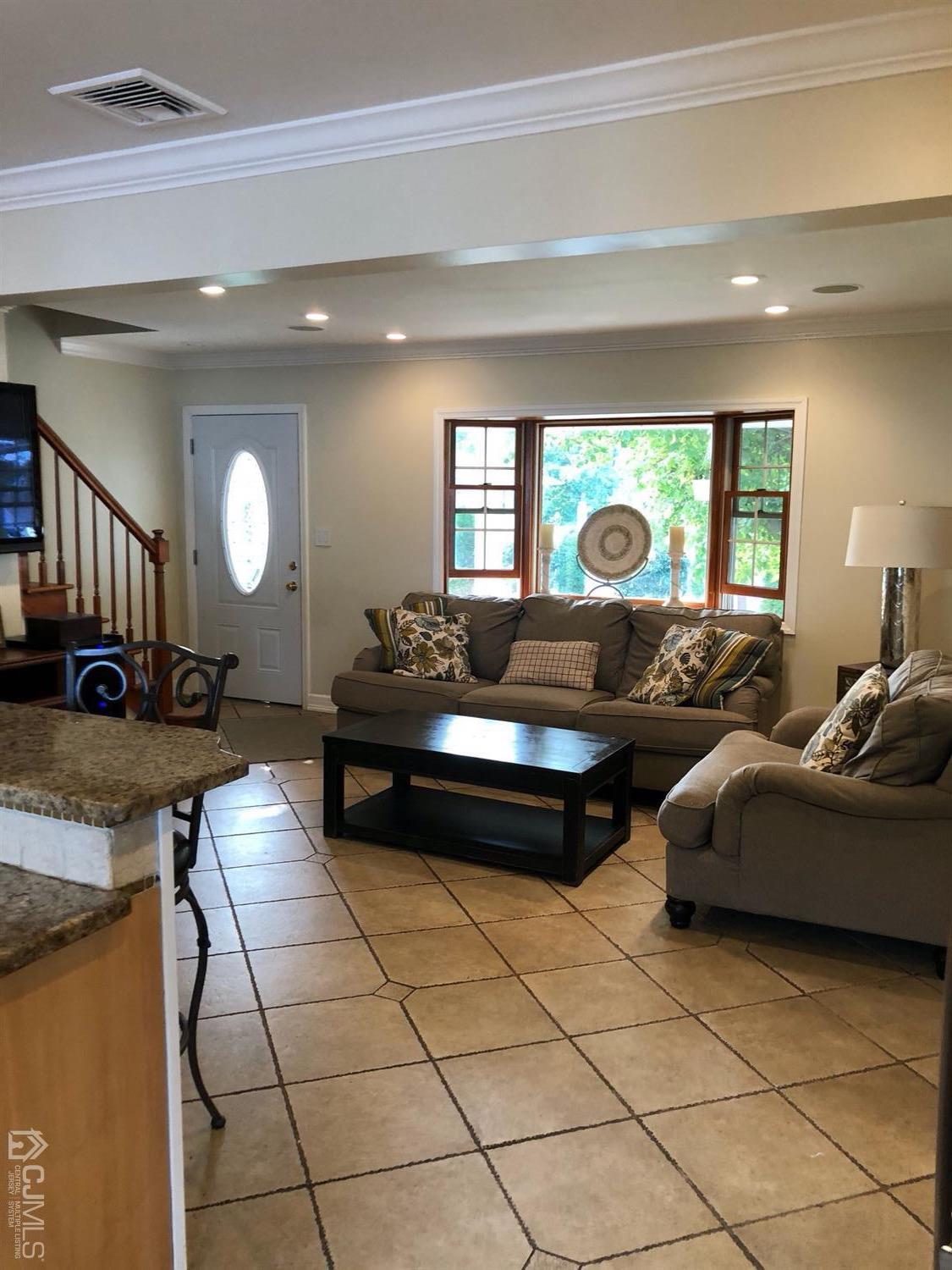 44 Hillcrest Road Colonia, NJ 07067 - Photo 3 of 23 a living room with furniture and a large window