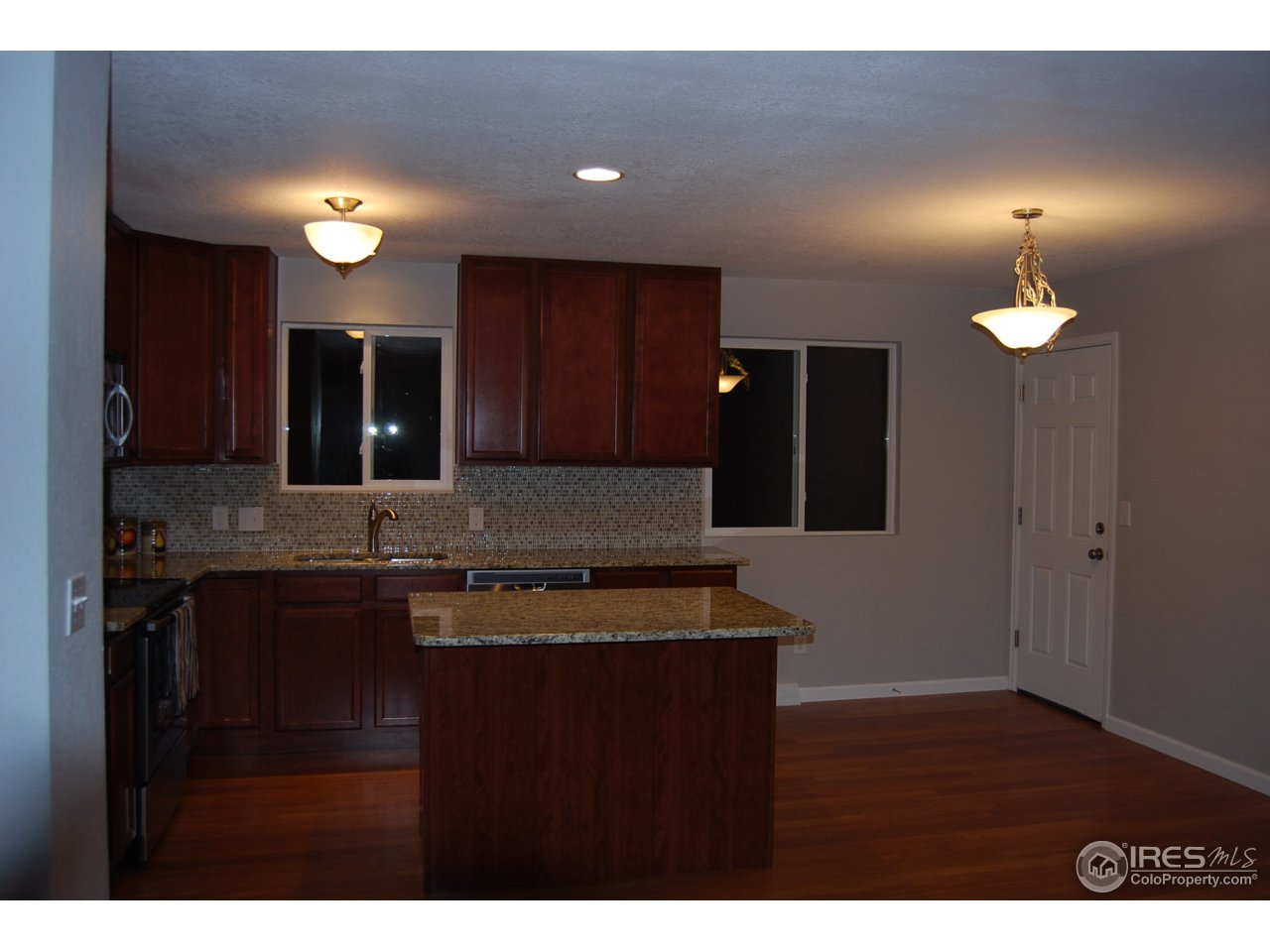 10747 Routt Street Westminster, CO 80021 - Photo 4 of 10 a kitchen with cabinets and sink