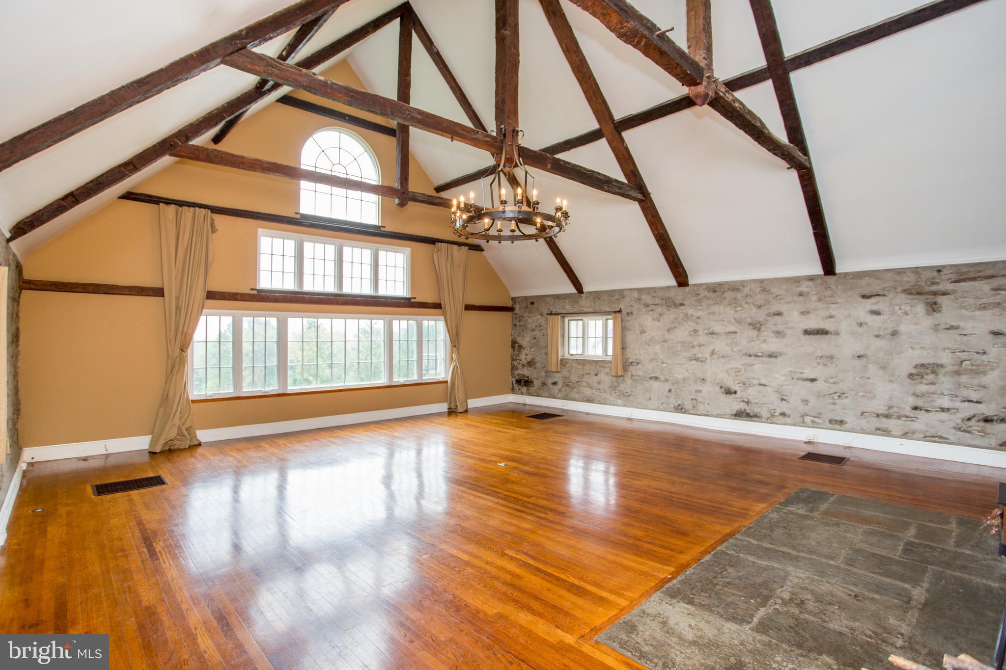 96 Stony Brook Road Hopewell, NJ 08525 - Photo 13 of 49 a view of an empty room with a window and wooden floor