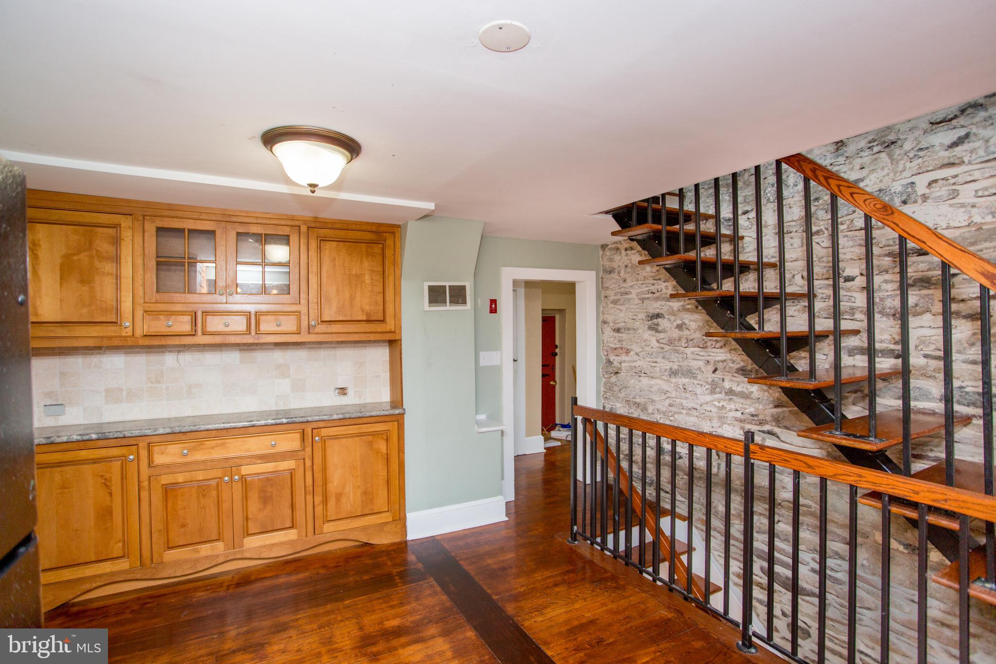 96 Stony Brook Road Hopewell, NJ 08525 - Photo 24 of 49 a view of a hallway with wooden floor and staircase
