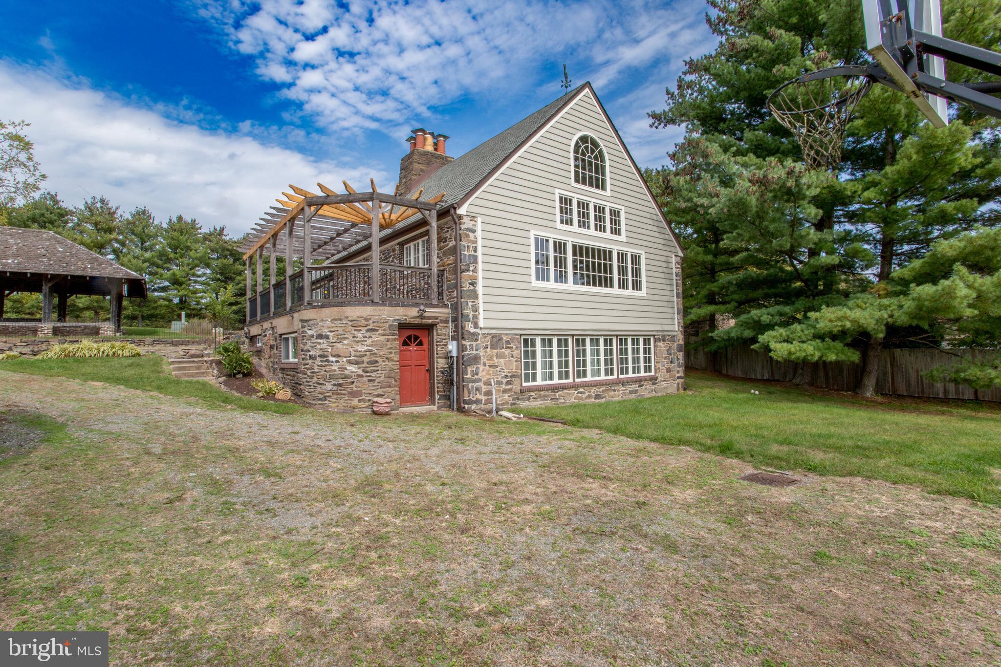 96 Stony Brook Road Hopewell, NJ 08525 - Photo 34 of 49 a view of a house with a yard