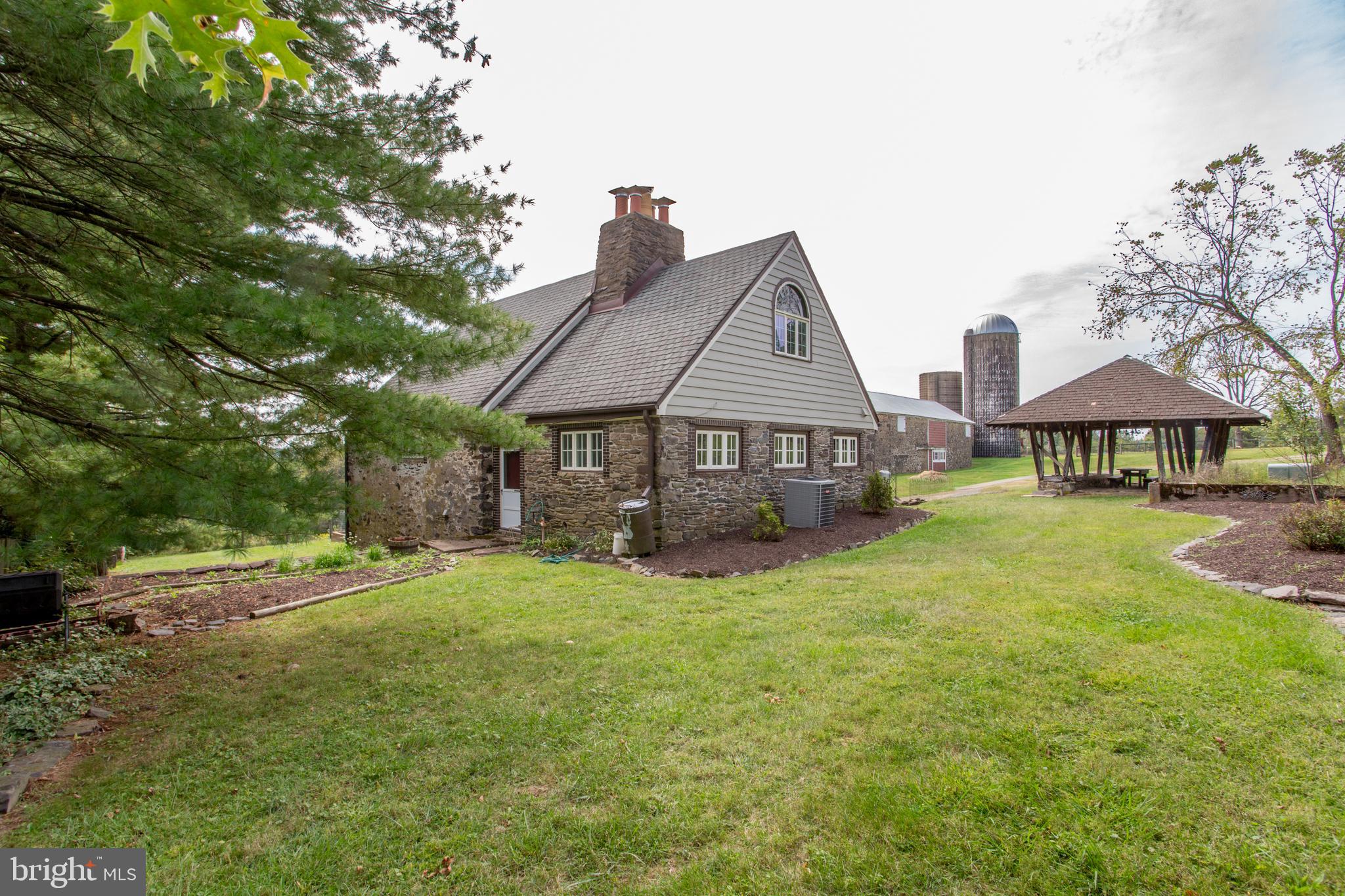96 Stony Brook Road Hopewell, NJ 08525 - Photo 37 of 49 a front view of a house with yard and green space