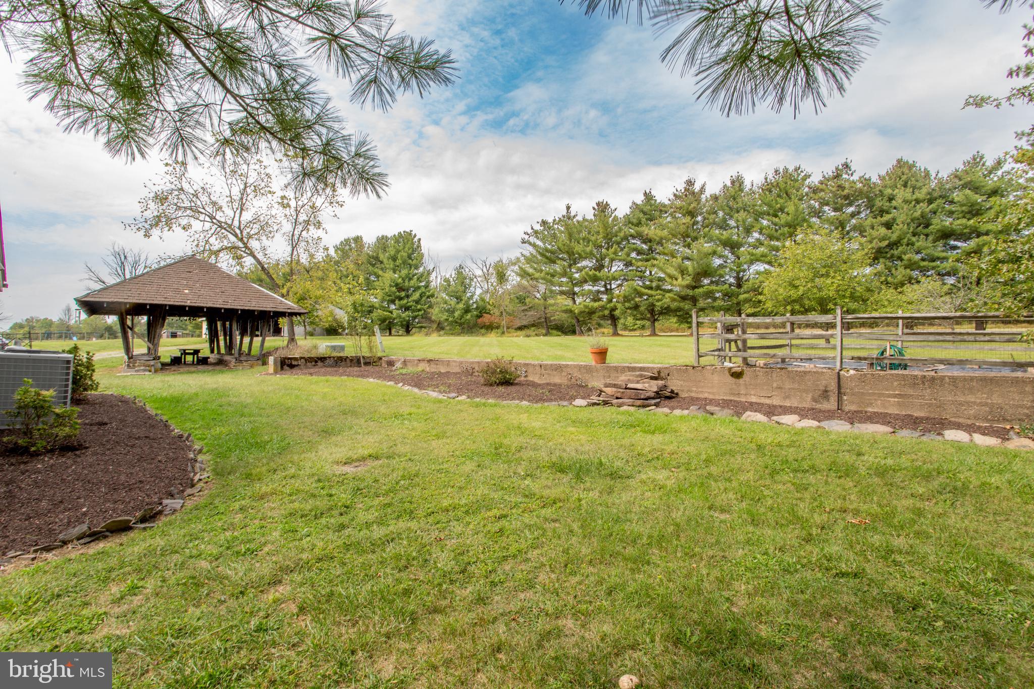 96 Stony Brook Road Hopewell, NJ 08525 - Photo 38 of 49 a view of a garden with an outdoor space