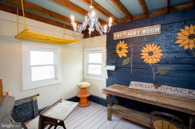 an aerial view of a house with a yard and lake view