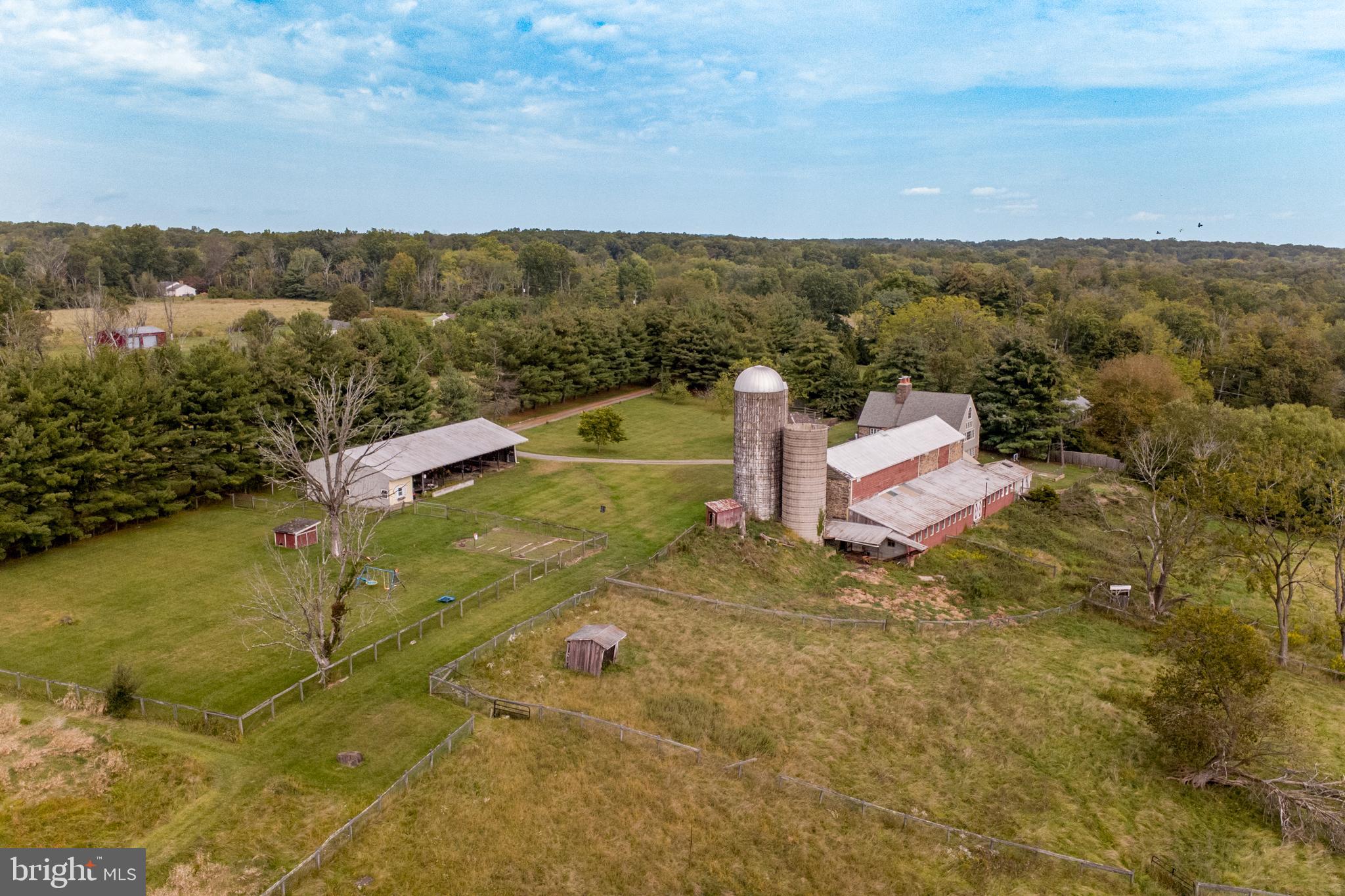 96 Stony Brook Road Hopewell, NJ 08525 - Photo 44 of 49 an aerial view of a house with a yard and lake view