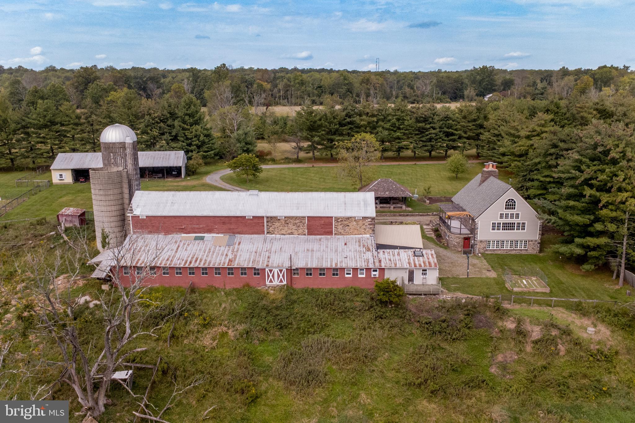 96 Stony Brook Road Hopewell, NJ 08525 - Photo 45 of 49 an aerial view of a house with a garden and lake view