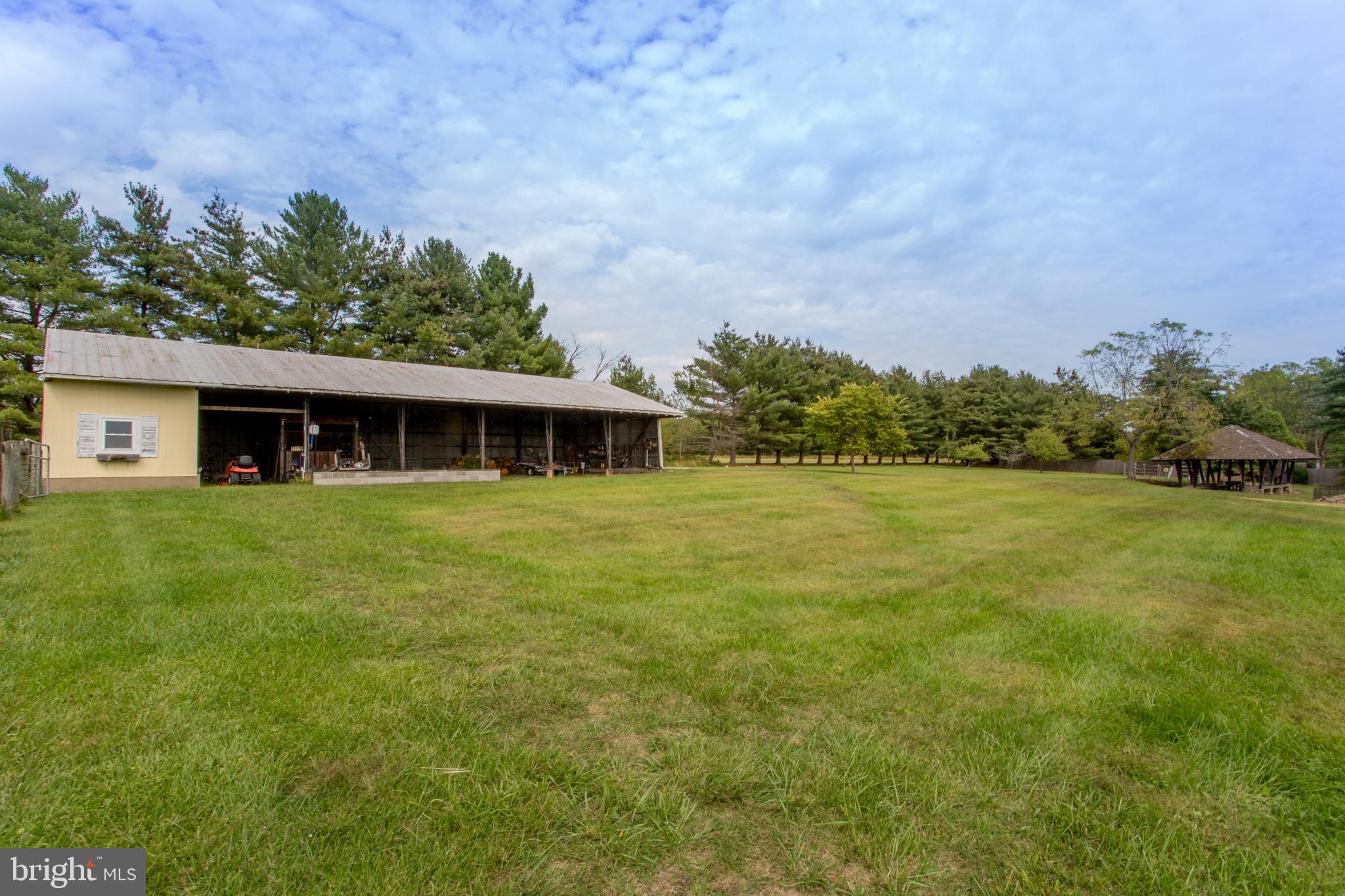 96 Stony Brook Road Hopewell, NJ 08525 - Photo 8 of 49 a front view of a house with a yard