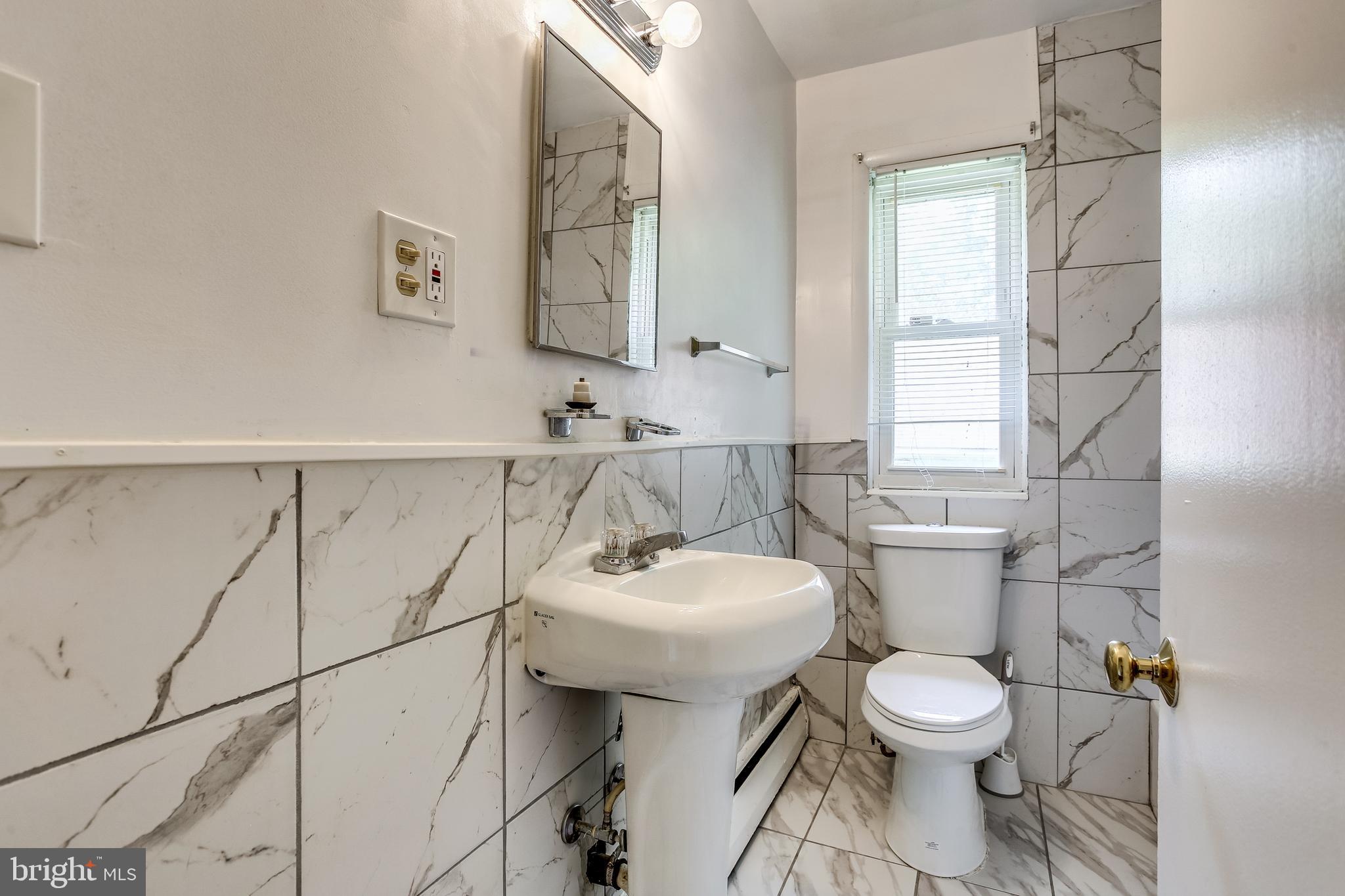 3722 Chesholm Road Baltimore, MD 21216 - Photo 18 of 23 Updated bath first floor