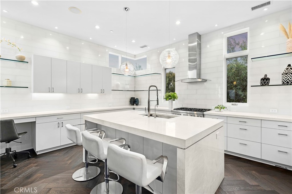 3731 5th Avenue Corona del Mar, CA 92625 - Photo 12 of 36 a kitchen with a sink cabinets and wooden floor