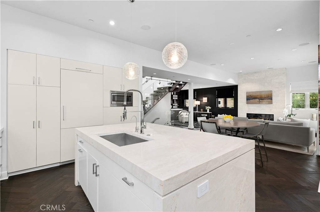 3731 5th Avenue Corona del Mar, CA 92625 - Photo 13 of 36 a kitchen with a sink appliances and wooden floor