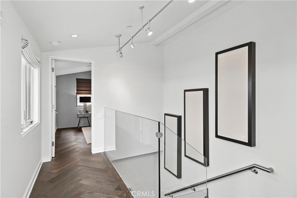 3731 5th Avenue Corona del Mar, CA 92625 - Photo 17 of 36 a view of a hallway with wooden floor and entryway