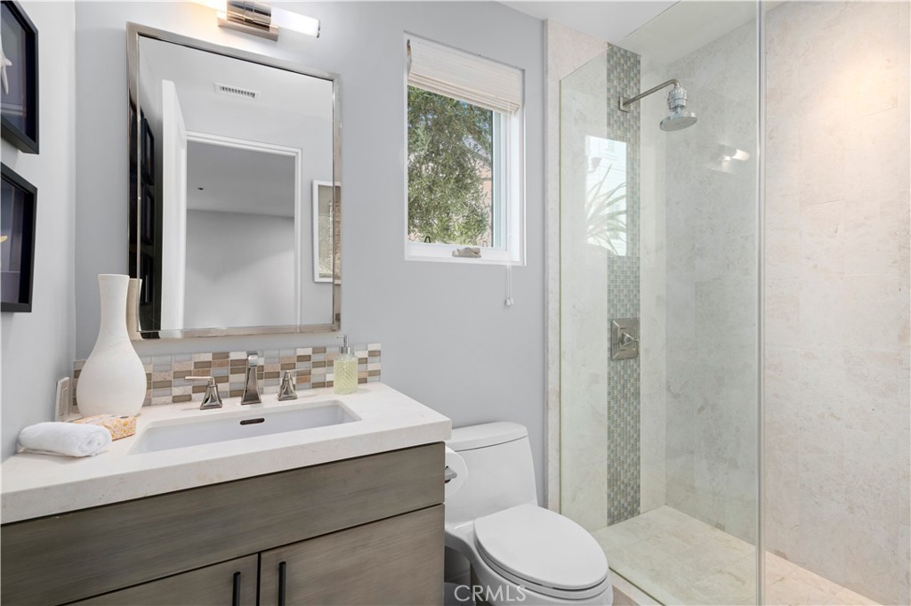 3731 5th Avenue Corona del Mar, CA 92625 - Photo 32 of 36 a bathroom with a sink a toilet and shower