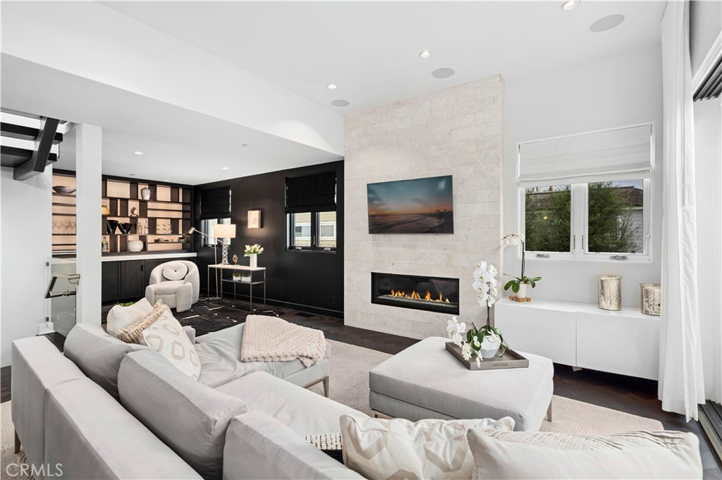 3731 5th Avenue Corona del Mar, CA 92625 - Photo 6 of 36 a living room with furniture fireplace and a flat screen tv