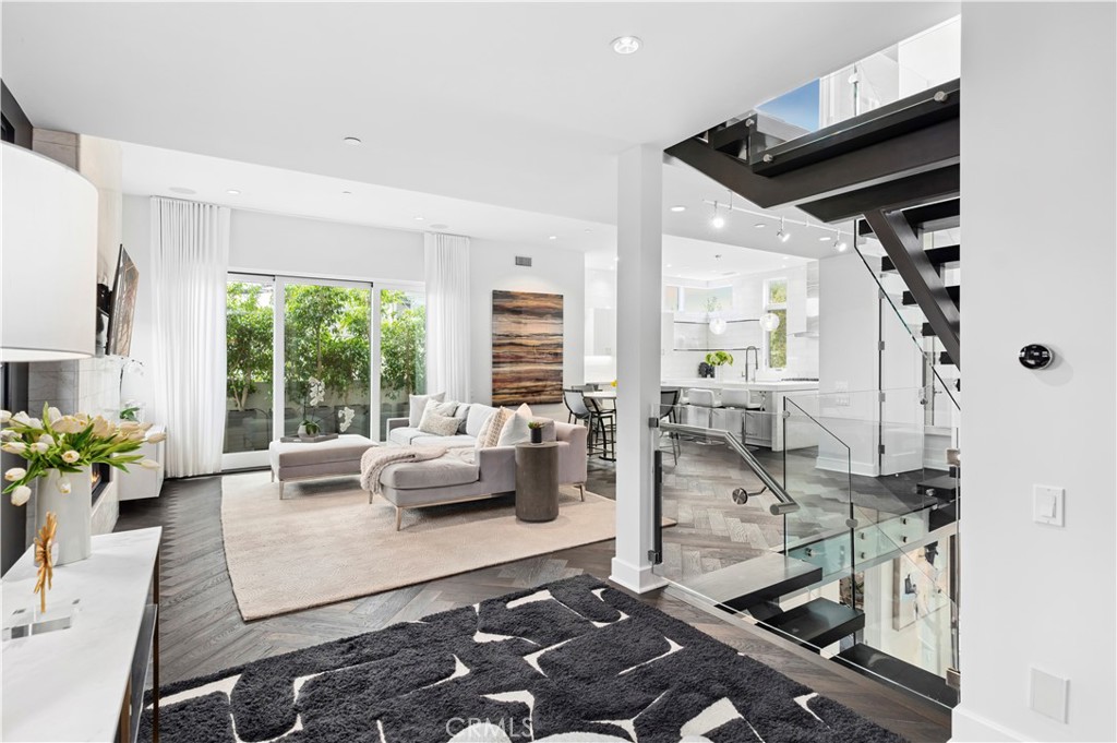 3731 5th Avenue Corona del Mar, CA 92625 - Photo 8 of 36 a living room with furniture and a floor to ceiling window