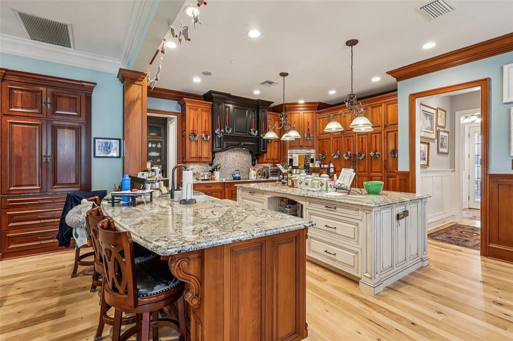 310 Acadia Lane Celebration, FL 34747 - Photo 15 of 52 a kitchen with center island table and chairs