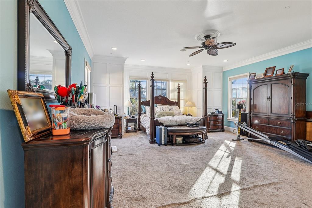 310 Acadia Lane Celebration, FL 34747 - Photo 26 of 52 a living room with furniture a flat screen tv and gym equipment