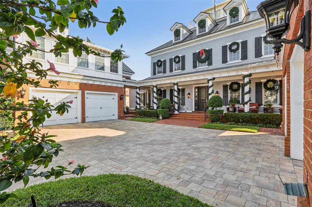 310 Acadia Lane Celebration, FL 34747 - Photo 3 of 52 a front view of a building with a garden and plants