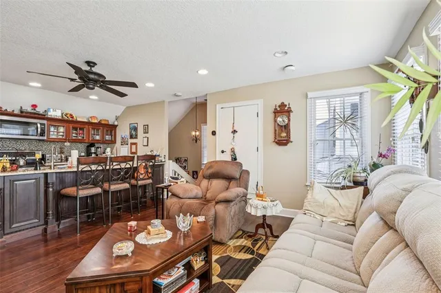 a open kitchen with stainless steel appliances granite countertop a kitchen island a stove and a sink