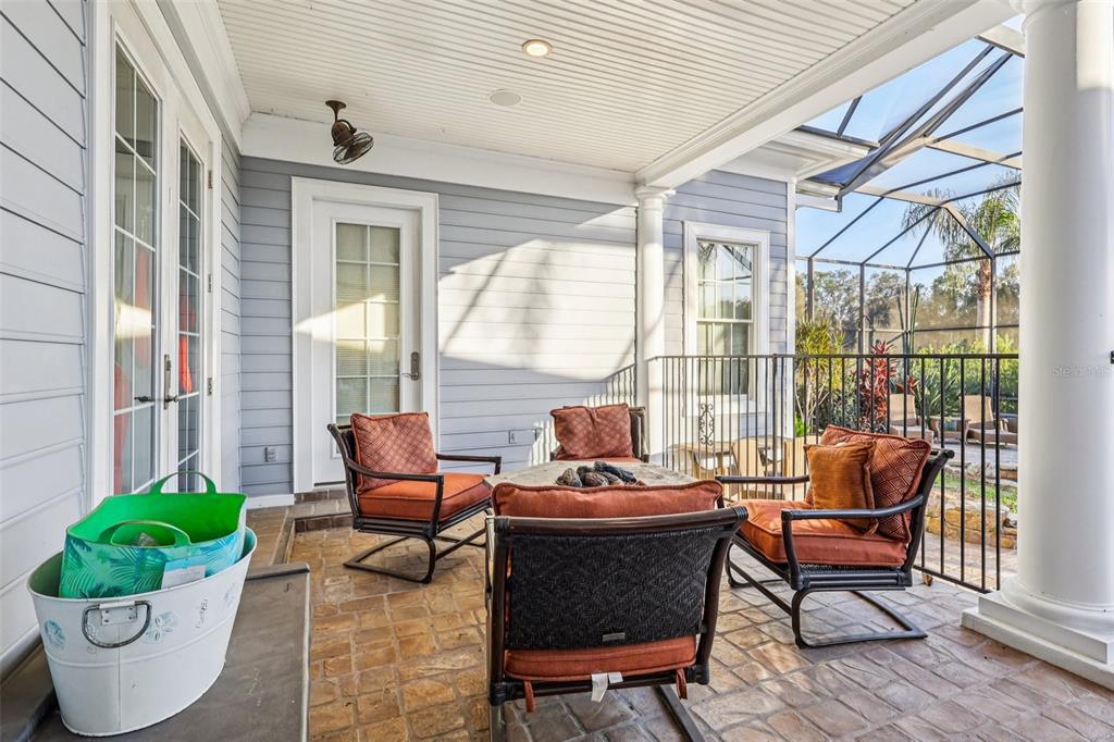 310 Acadia Lane Celebration, FL 34747 - Photo 43 of 52 a outdoor living space with furniture and a potted plant