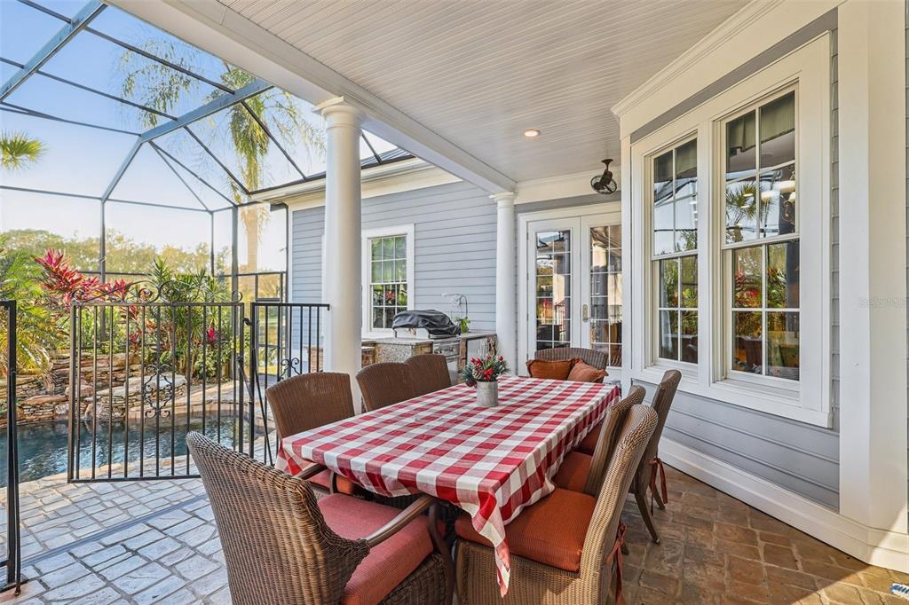 310 Acadia Lane Celebration, FL 34747 - Photo 44 of 52 a dining room with furniture and wooden floor