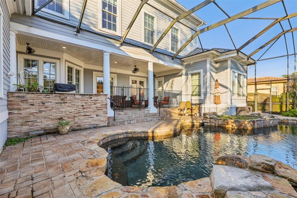 310 Acadia Lane Celebration, FL 34747 - Photo 45 of 52 a view of a swimming pool with outdoor seating