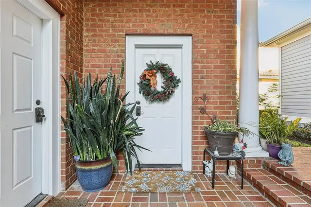 a potted plant sitting in front of a house