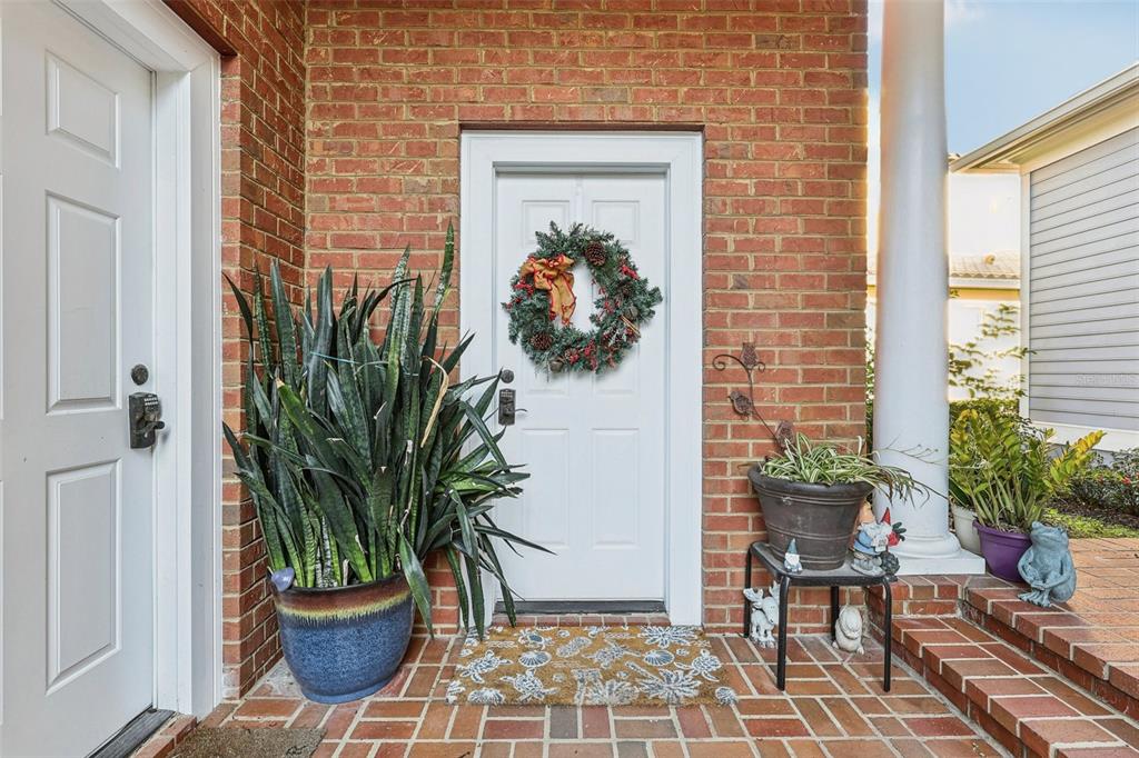 310 Acadia Lane Celebration, FL 34747 - Photo 6 of 52 a potted plant sitting in front of a house