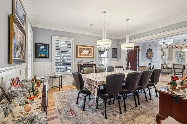 wooden floor in a room with lots of white walls