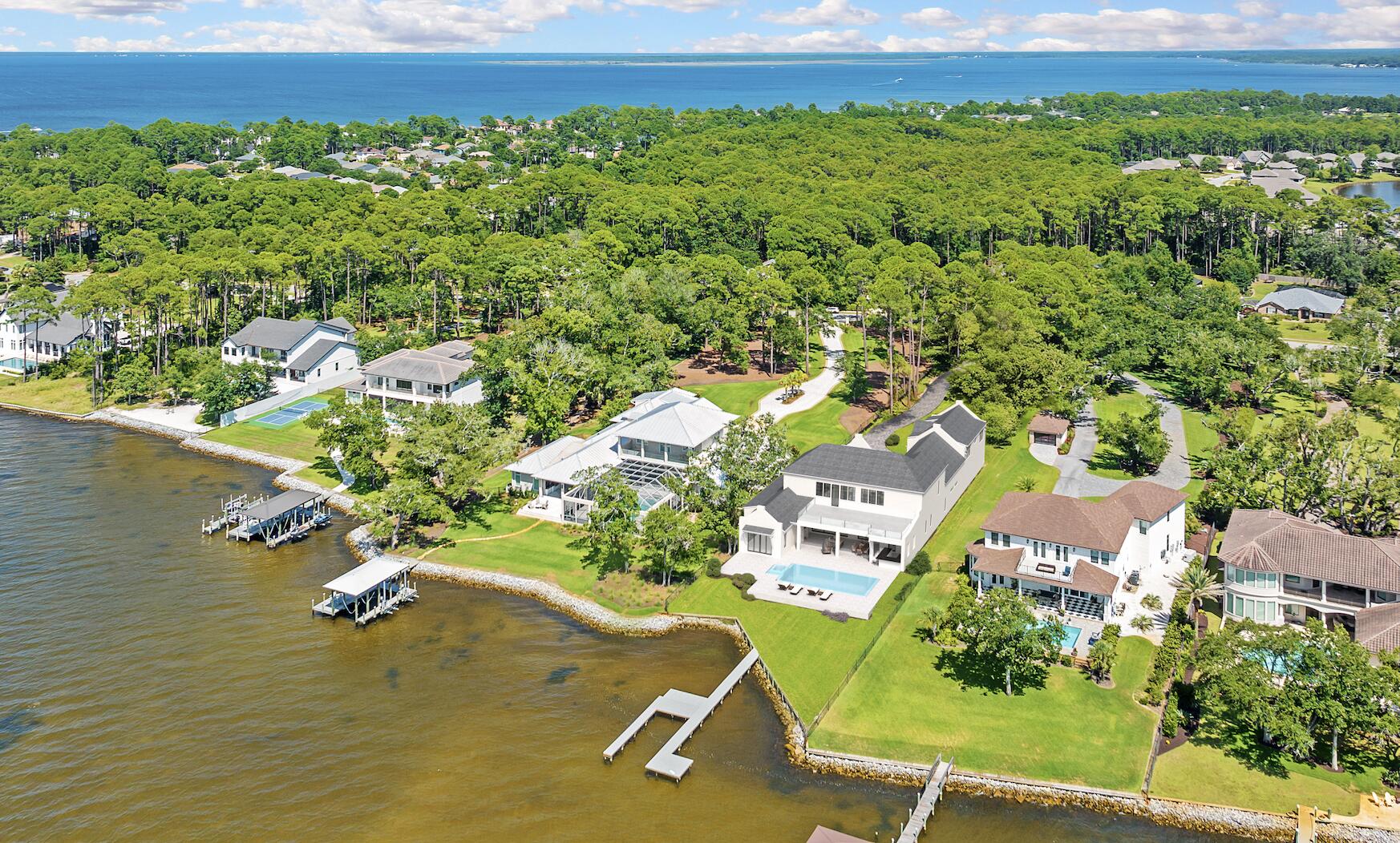 525 Driftwood Point Road Santa Rosa Beach, FL 32459 - Photo 4 of 4 an aerial view of a house with a yard and lake view