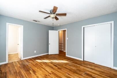 4007 39th Street Lubbock, TX 79413 - Photo 11 of 16 a view of a livingroom with wooden floor and a ceiling fan