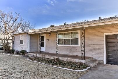 4007 39th Street Lubbock, TX 79413 - Photo 2 of 16 a view of a house with a backyard