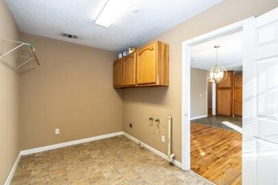 4007 39th Street Lubbock, TX 79413 - Photo 9 of 16 a view of a livingroom with wooden floor and a bathroom