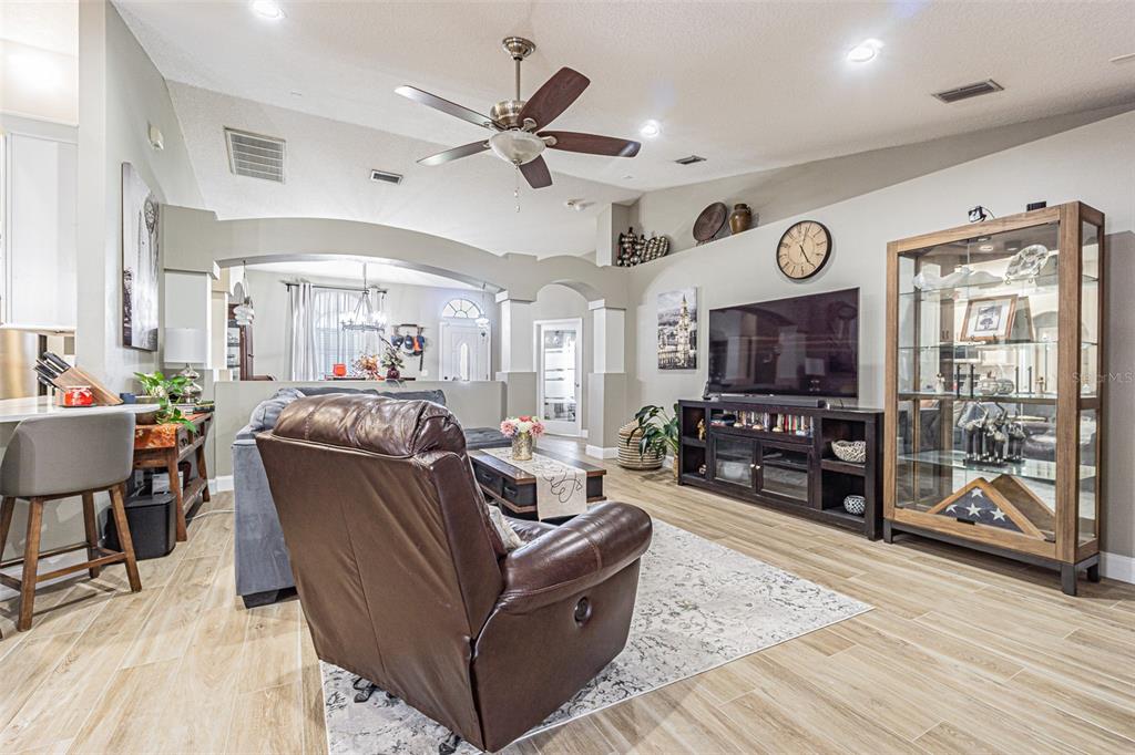9809 La Rita Place Riverview, FL 33569 - Photo 11 of 59 a living room with furniture and a flat screen tv with wooden floor