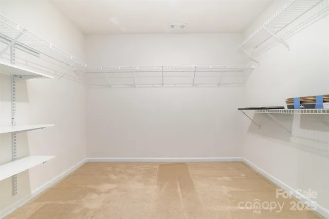 a view of a room with racks on the wall