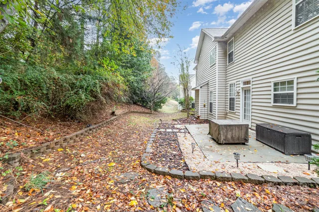 a view of a backyard with table and chairs