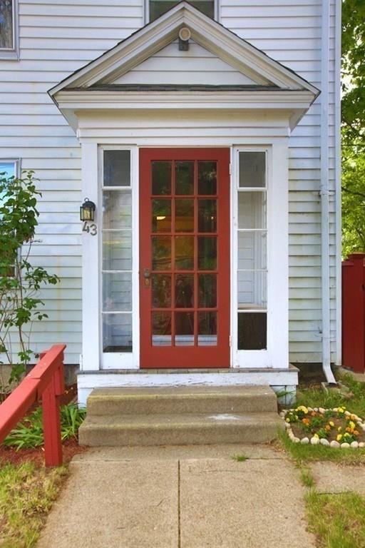 43 Oak Street Newton, MA 02464 - Photo 1 of 20 a view of a house with a large window and a yard