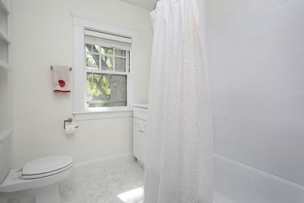 43 Oak Street Newton, MA 02464 - Photo 14 of 20 a white toilet sitting next to a window