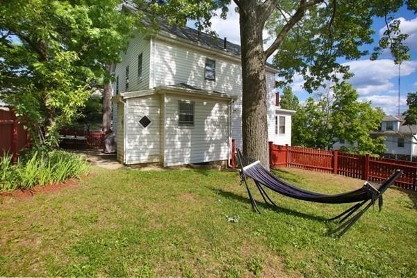 43 Oak Street Newton, MA 02464 - Photo 17 of 20 a backyard of a house with yard and trampoline