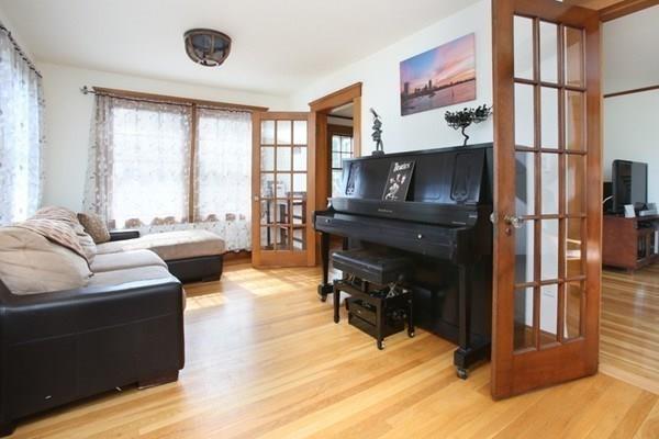 43 Oak Street Newton, MA 02464 - Photo 7 of 20 a living room with furniture a fireplace and a large window
